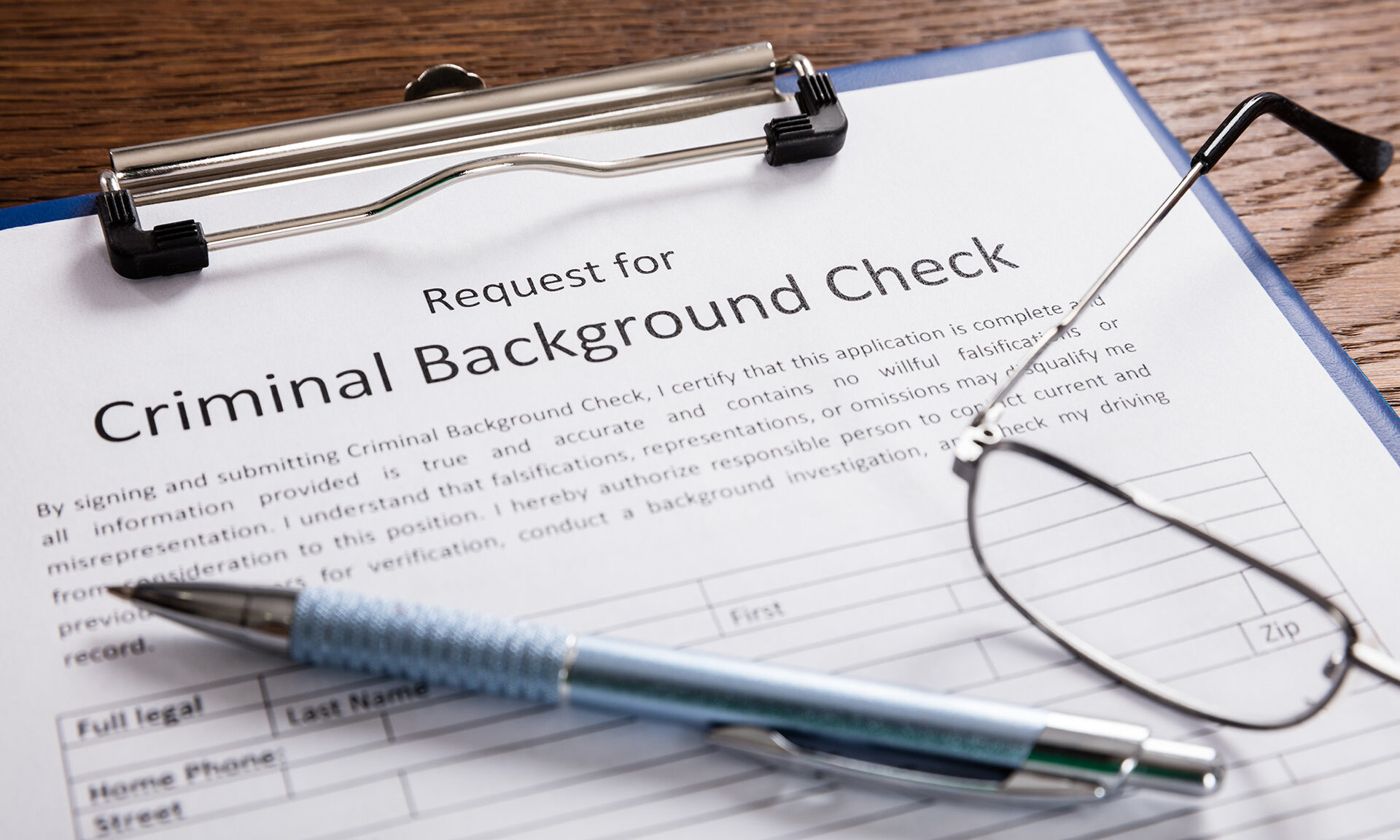 clipboard with page titled, "Criminal Background Check Request"